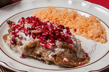 rich and traditional chiles en nogada typical of Mexico