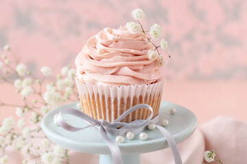 Dessert stand with tasty wedding cupcake on table