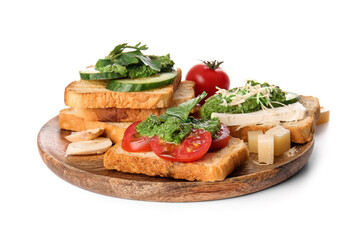 Tasty toasts with pesto sauce on white background