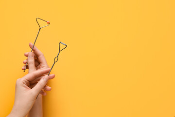 Woman with logopedic tools for speech correction on color background