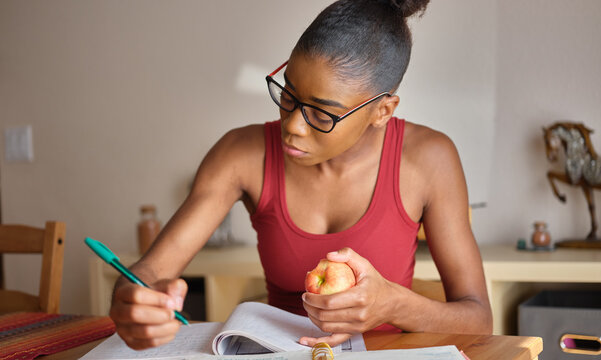 African American Woman Studying At Home