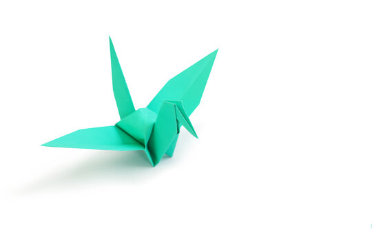Origami crane isolated over white studio background. Image with Clipping path and copy space