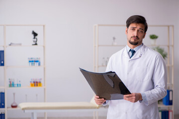Young male doctor radiologist working in the clinic