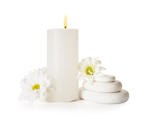 Fototapeta na wymiar Composition with burning candle, spa stones and chamomile flowers on white background