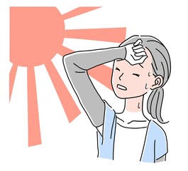 屋外で暑そうにしている女性