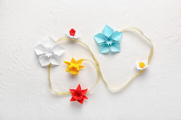 Origami daffodils on light background