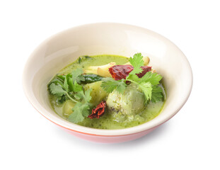 Bowl of tasty green chicken curry on white background