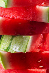 Red raw watermelon pieces close up shot