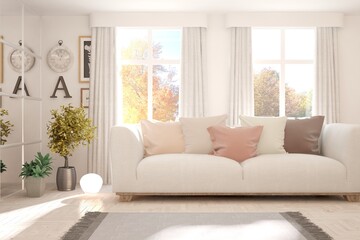 Stylish room in white color with sofa and autumn landscape in window. Scandinavian interior design. 3D illustration