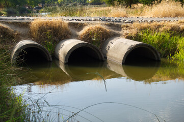 Concrete pipes for drainage from pond 