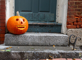 smiling pumpkin with braces. funny Halloween pumpkin on the doorstep. Orthodontic or dentist...