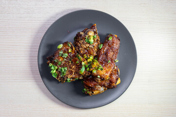 A plate of glazed pork ribs.