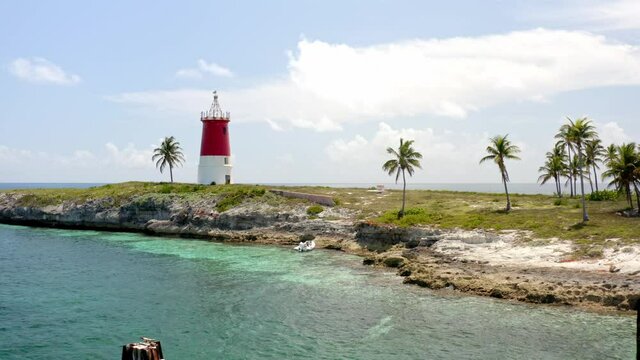 Abandoned Lighthouse On The Island Of Gun Cay In The Bahamas. drone pullback