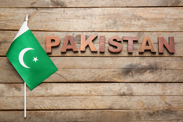 Flag of Pakistan on wooden background