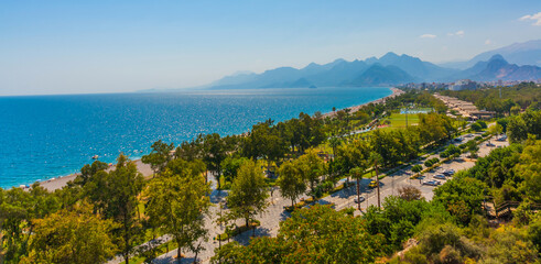 Fototapeta na wymiar ANTALYA, TURKEY: Bird's-eye view of Konyaalti beach, Mediterranean Sea and mountains in summer.