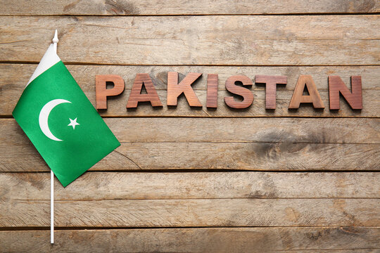 Flag of Pakistan on wooden background
