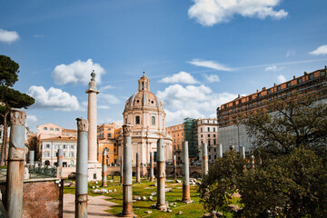 Obraz premium Trojan column and churches of Santa Maria di Loreto. Ruins of a forum of Trajan in the night. Trajan's Column on Trajan's Forum in Rome, Italy. travel and vacation.