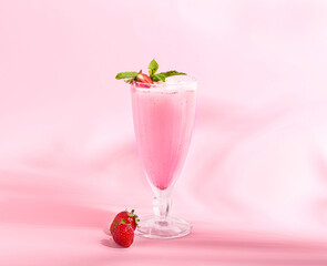 Glass of strawberry Pina Colada cocktail on color background
