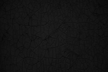 Abstract black background. Cracked paint texture. Dark background with cracks with copy space for design. Web banner.