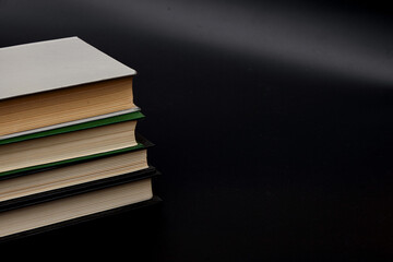 Stack of colorful books. An open book on a stack of books. The concept of education, international...