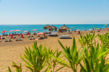 ANTALYA, TURKEY: Gazebos, sun loungers and umbrellas on the Lara beach on a sunny summer day in Antalya.