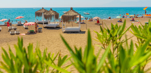 ANTALYA, TURKEY: Gazebos, sun loungers and umbrellas on the Lara beach on a sunny summer day in Antalya.