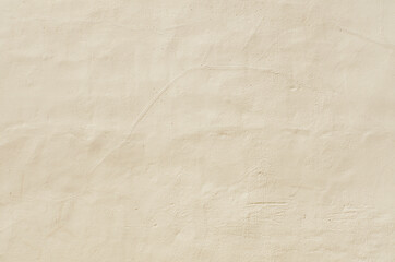 Abstract beige cement plastered wall texture background.