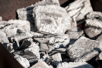 Extinguished coals close-up. Natural texture.