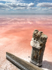 Wooden frame from the salt mining industry. Pink salty lake.