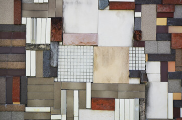 Textures of brick and tile samples randomly placed on the wall. Background of wall art expressing...