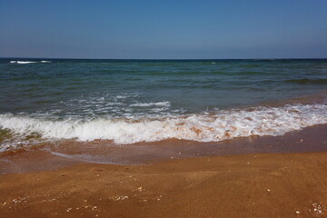 Wave of the sea on the sand beach