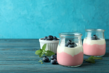 Concept of tasty breakfast with yogurt on wooden table