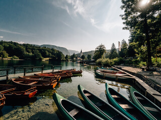 Lake Bohinj, Slovenia. Wooden boats on lake.