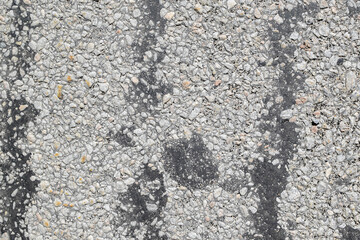Texture of old asphalt road, stone gray background