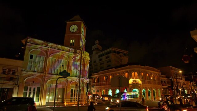 Phuket,Thailand-July,26,2021: Amazing colorful lighting show on the beautiful buildings in Phuket Old Town .with Sino-Portuguese architecture one of the landmarks in Phuket City at night.
