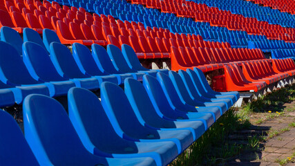Plastic seats in red and blue in the old stadium