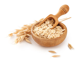 Oat flake in wooden bowl with spoon and spikelets of oats isolated. Bowl of oats on white background.