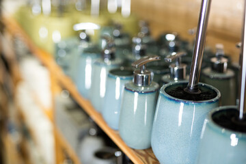 Obraz premium Variety of bathroom accessories displayed on shelving in household goods store. Concept of organizing comfortable home space