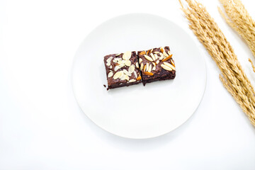 Brownie in dish on white background.