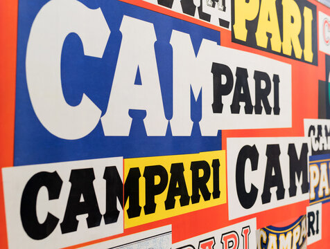 Multicolored Campari logo viewed at an oblique angle