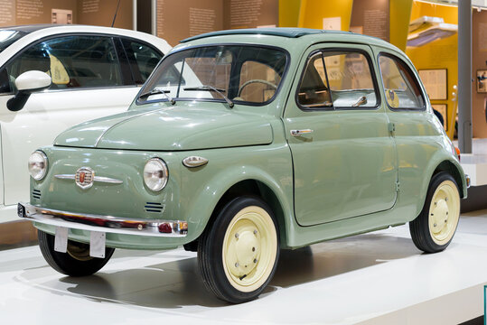 Green 1957 original Fiat 500 Italian car on display