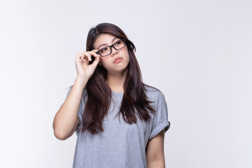 Attractive beautiful asian young woman thinking and looking upwards on white background.