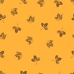  seamless pattern with delicate leaves on a mustard yellow background. Vector grunge leaf print. Printing on fabric, wallpaper, packaging, stylization under a stamp or an imprint of summer leaves;