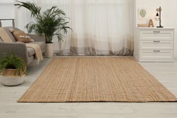 Stylish rug on floor in room. Interior design