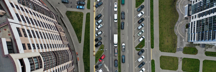 Road with cars near multistorey building top view