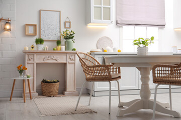 Decorative fireplace with beautiful spring flowers indoors. Interior design