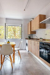 Kitchen interior decorated with furniture and appliances