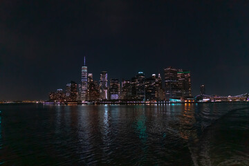New York city skyline at night viewed from Hudson river