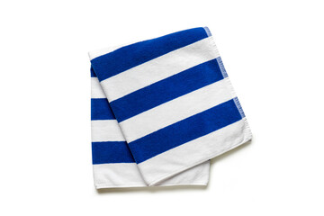 Folded soft terry blue and white towel on white background, top view
