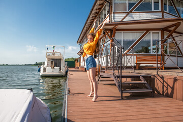 young woman on the pier in summer